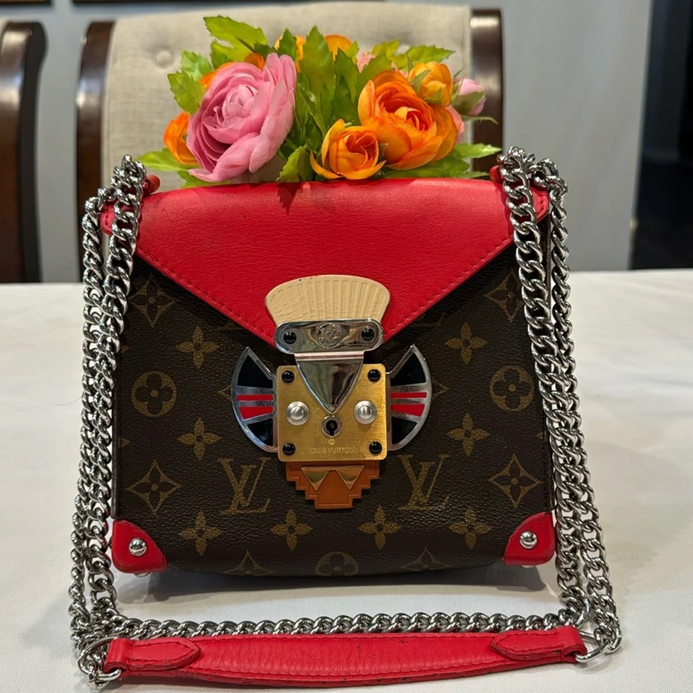 Authentic Louis Vuitton Tribal mask chained shoulder bag